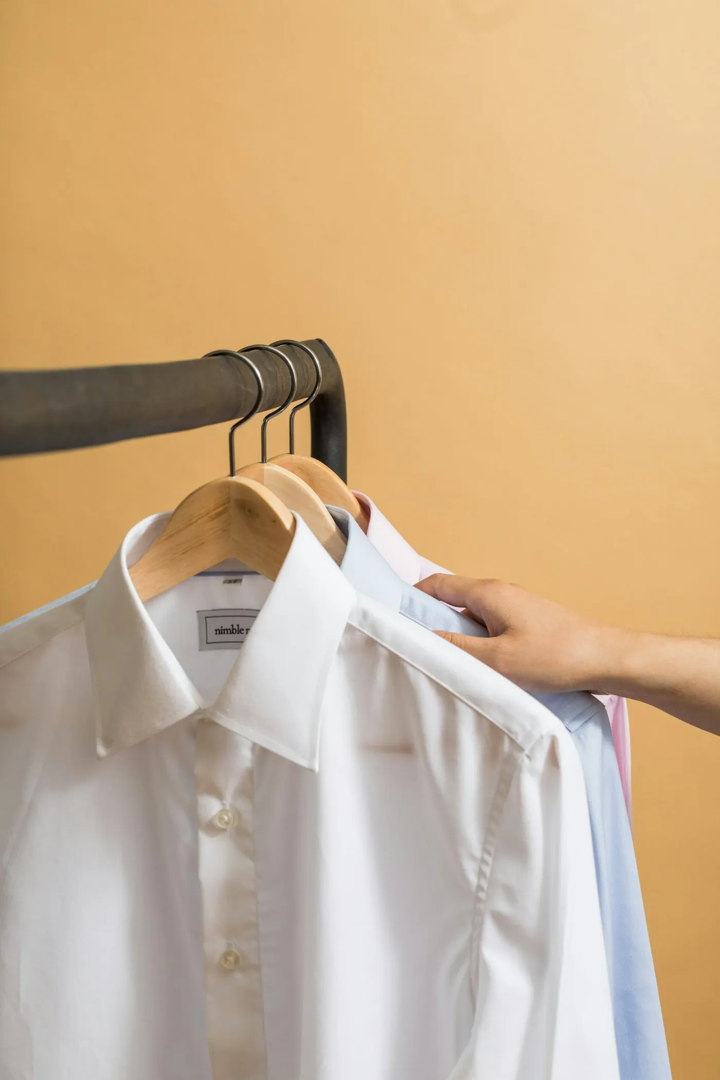 Clean, pressed white shirt on a hanger — International Laundries VIP Jeddah